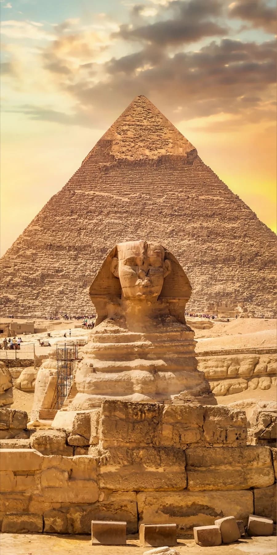 Great Sphinx with a pyramid behind it on the Giza plateau